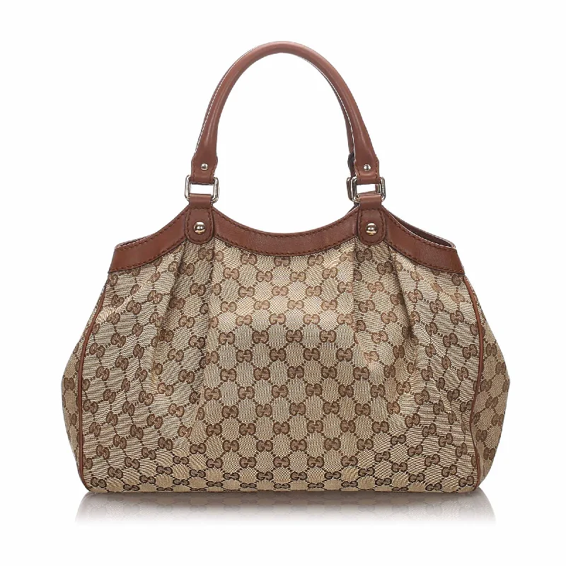 Ladies Gucci handbags with a detachable coin purse insideGucci Brown Canvas Fabric Guccissima Sukey Tote Italy