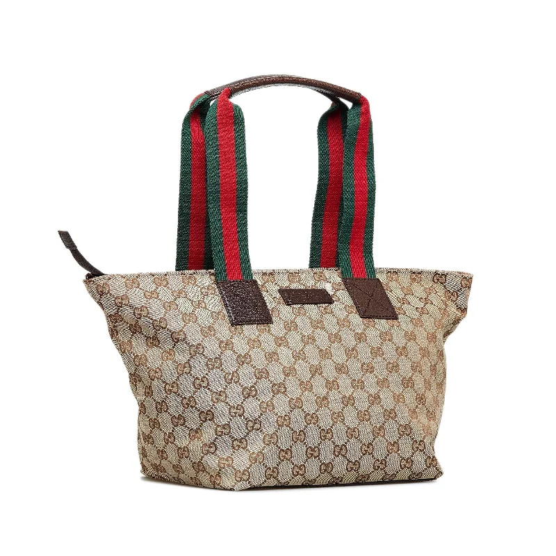 Women Gucci bags with a zippered interior pocketGucci GG Canvas Web Tote (SHG-V3zgvm)