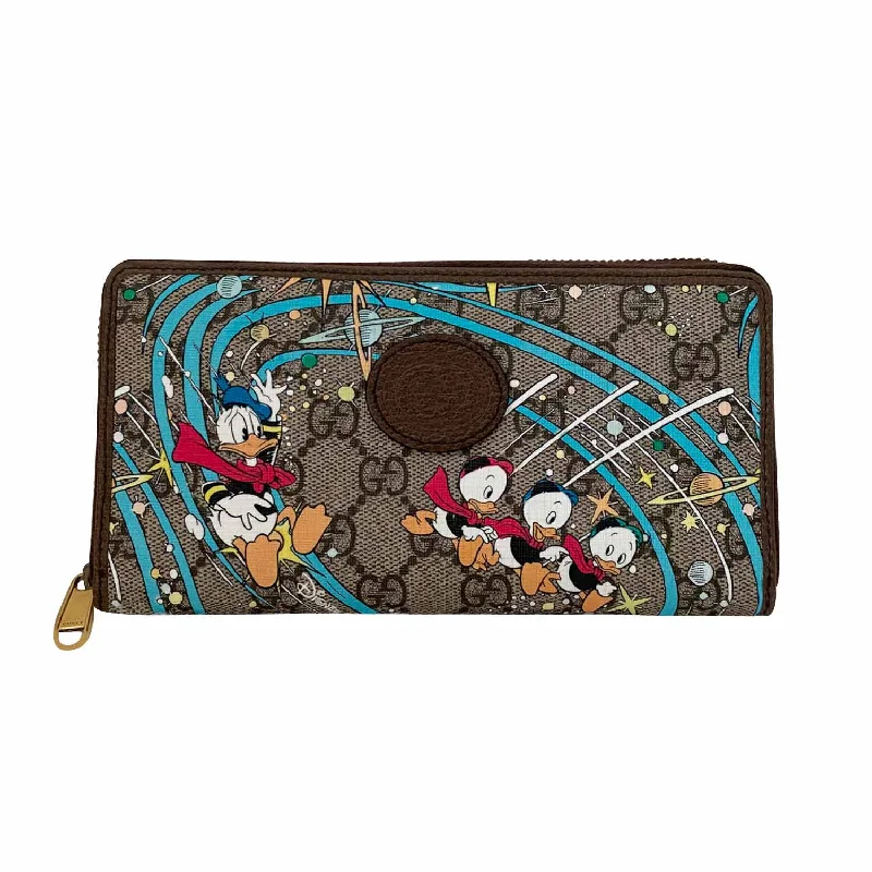 Women Gucci Sylvie bags with a monogram - embossed leatherGucci Limited Edition Disney Donald Duck Continental Wallet