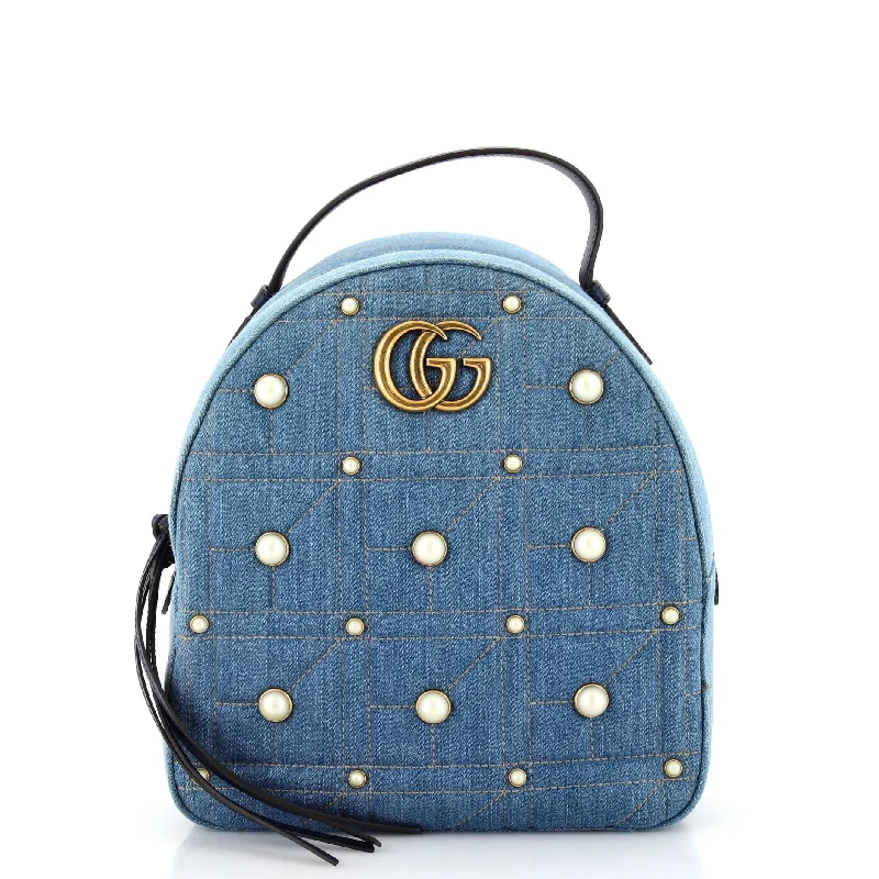 Women Gucci bags with a snap - button closure and a decorative charmGucci Pearly Gg Marmont Backpack