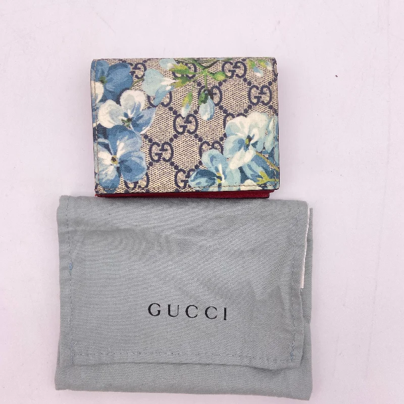 Women Gucci backpacks with a luxurious leather finishGucci Blue Floral GG Supreme Canvas Clutch Wristlet