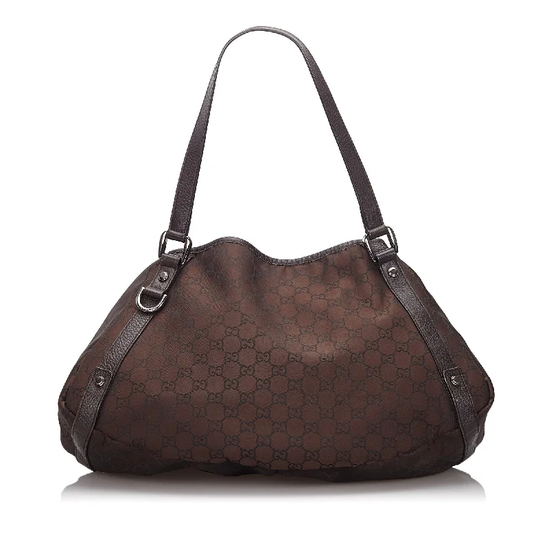 Women Gucci Sylvie bags featuring the signature web stripeGucci Brown Dark Canvas Fabric GG Pelham Tote Bag Italy