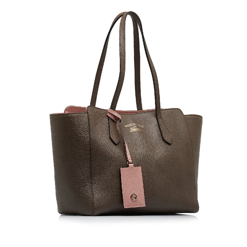 Women Gucci bags with interlocking G hardware for a classic lookGucci Swing Tote Medium Brown Leather