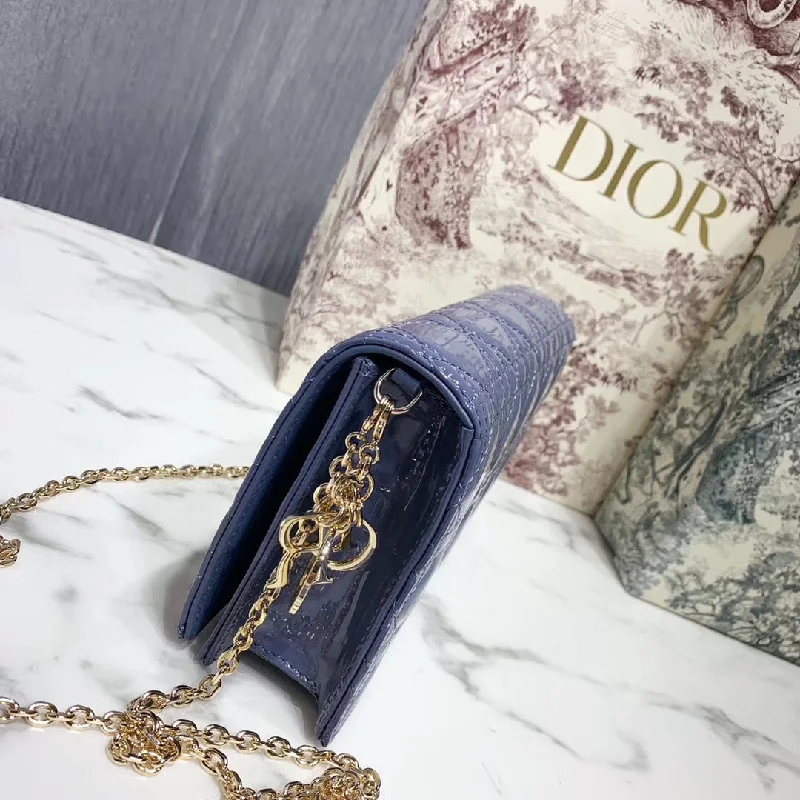 Christian Dior handbags with a snap - button closure and a decorative buckleDior Lady Dior Clutch With Chain In Denim Blue Patent