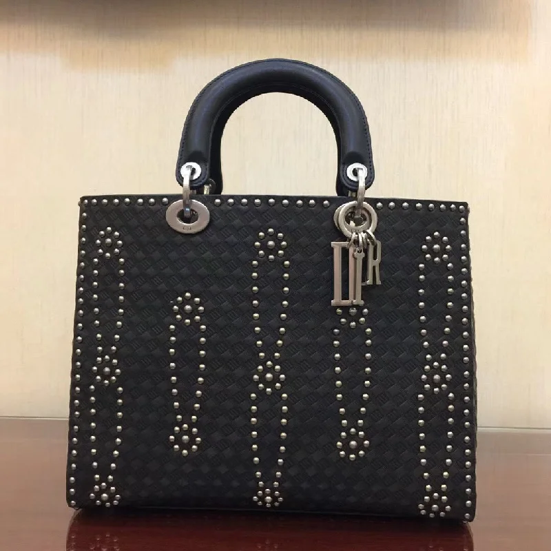 Christian Dior Saddle bags with a studded trim for a bold lookDior Large Lady Dior Bag In Black Studded Calfskin